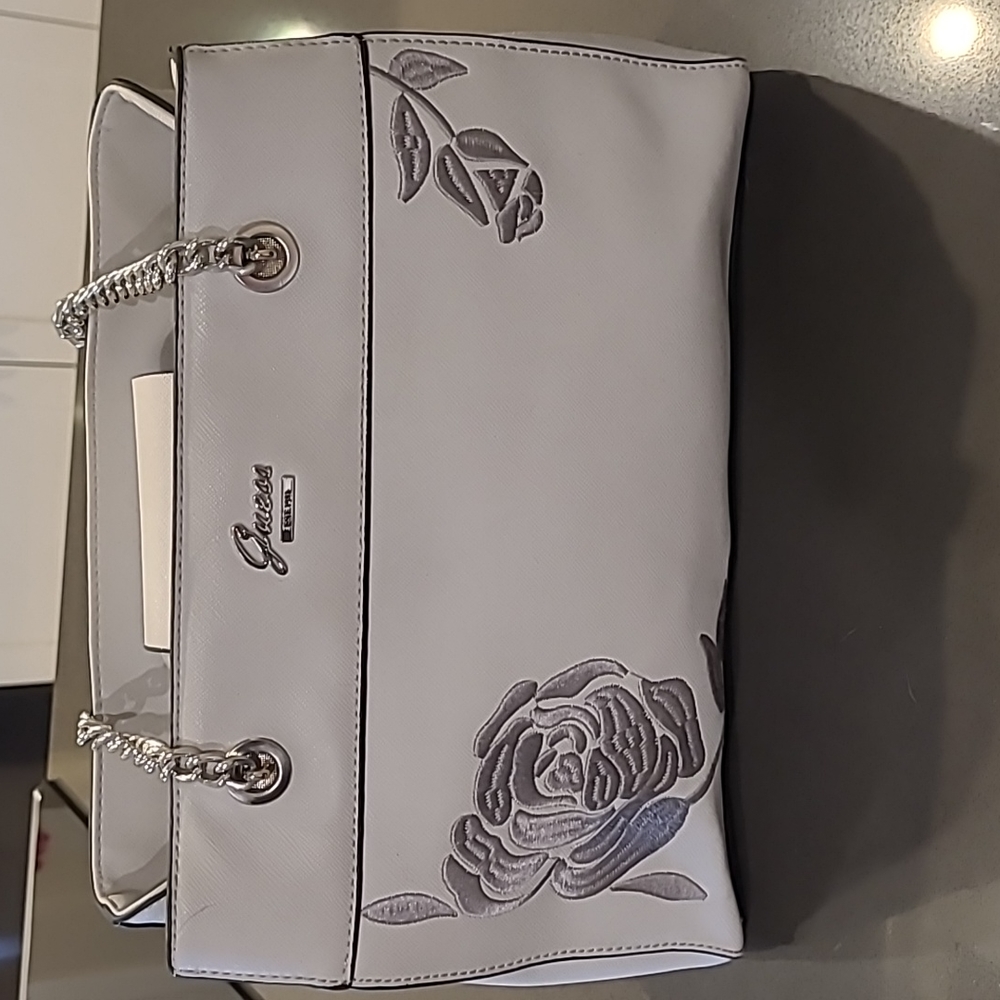 Guess purse. Grey with embroidery. Zippered middle compartment.